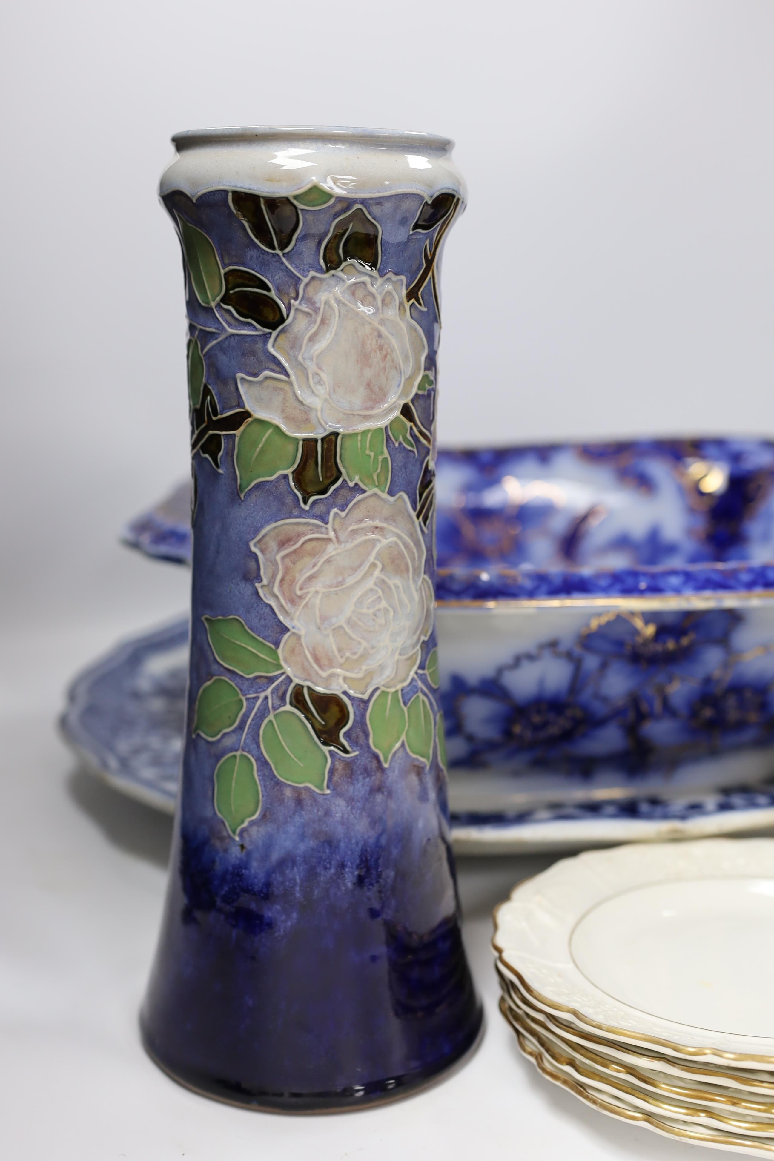 A Flow blue and gilt decorated bowl, a blue and white meat platter, a Royal Doulton vase, a gilt Egyptian inspired centrepiece and set of six gilt bordered plates